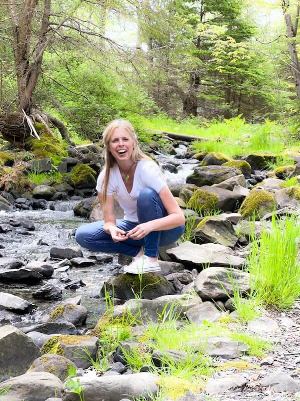 Jill MacKay, Energy Recovery Program for Women - Overcome Fatigue and Burnout, smiling by the brook